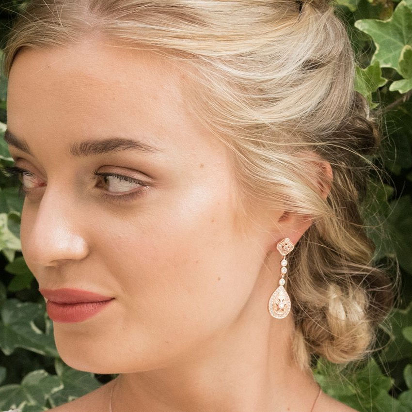 Thumbnail: Rose gold earrings with art deco style pave dropper, worn by model
