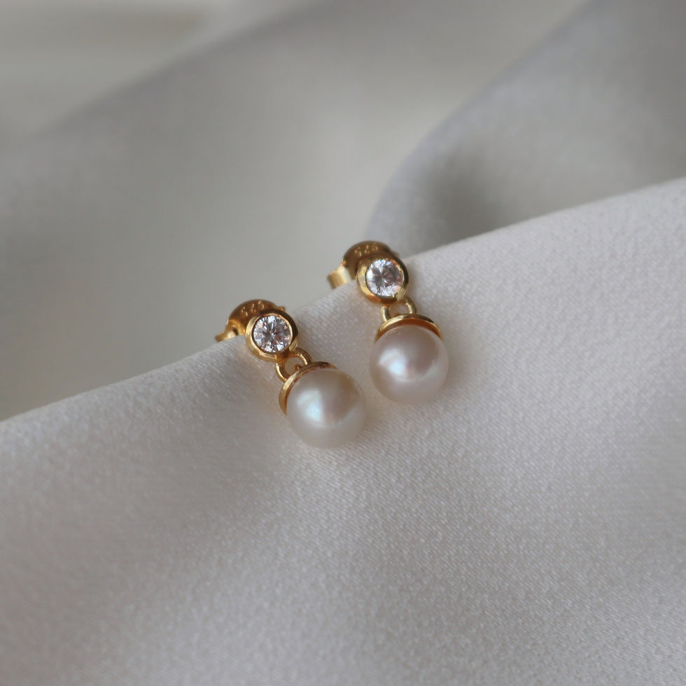 Thumbnail: Gold earrings with a delicate cubic zirconia solitaire stud and ivory freshwater pearl dropper.
