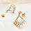 Thumbnail: Gold earrings with chandelier style dropper with cubic zirconia