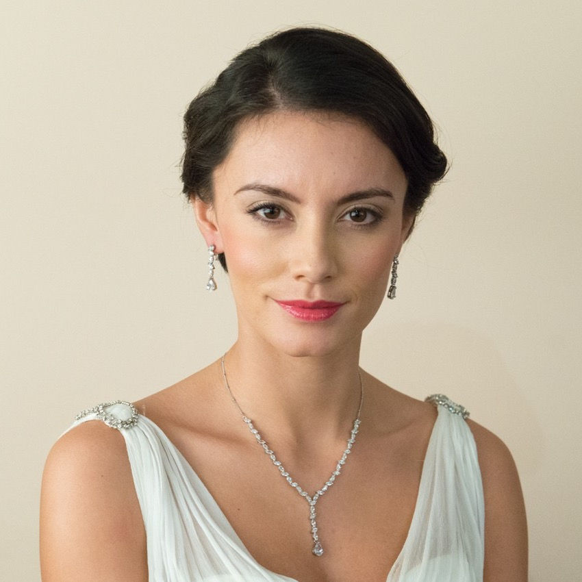 Thumbnail: Silver dropper earrings with marquise cut man-made diamonds set in a design and finished with a pear cute stone at the bottom