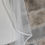 Thumbnail: Ivory tulle veil with satin edging