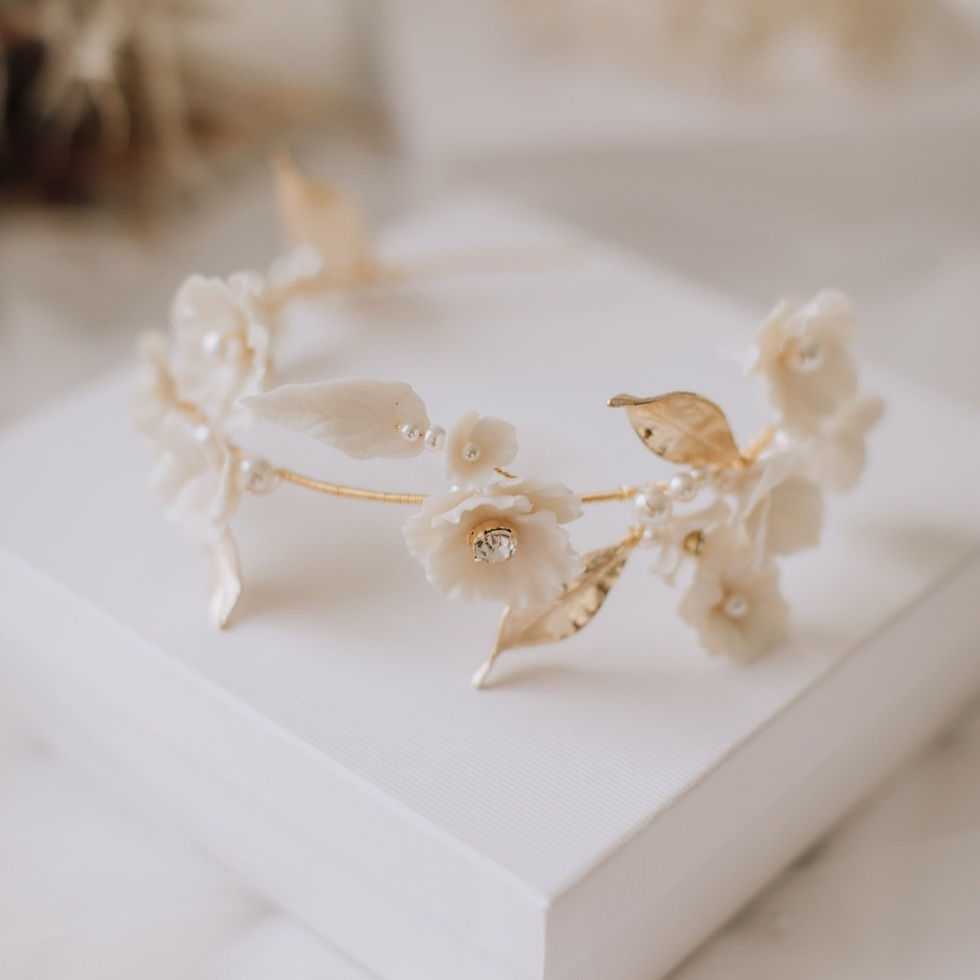 Thumbnail: Bridal headpiece made of gold wire with ivory clay flowers, gold leaves, ivory pearls and diamante