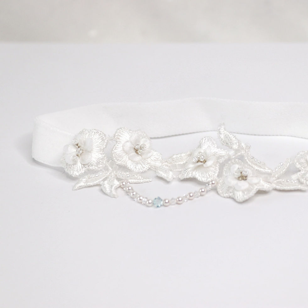 Thumbnail: Guipure lace bridal garter embellished with satin flowers with delicate pink pearls and crystals