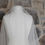 Thumbnail: Ivory tulle veil with satin edging