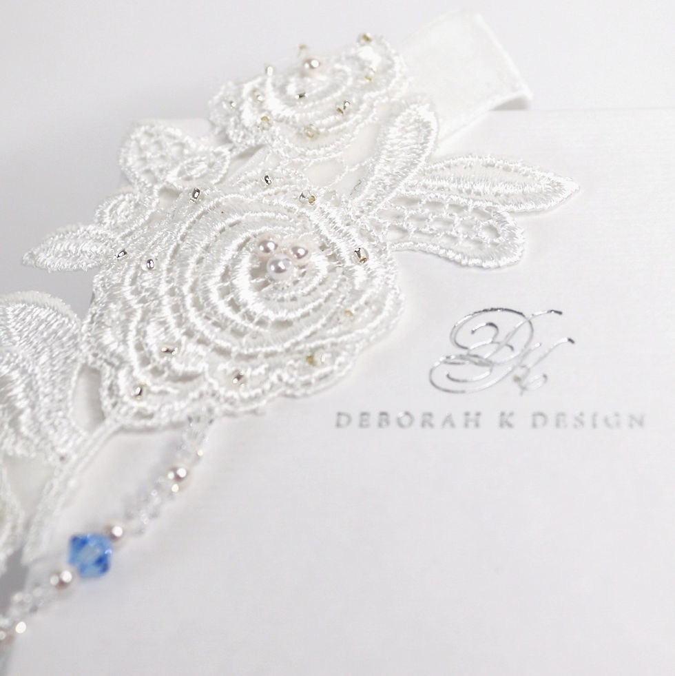 Ivory bridal garter with guipure lace roses and leaves, embellished with seed beads, pearls and crystals, blue ribbon bow