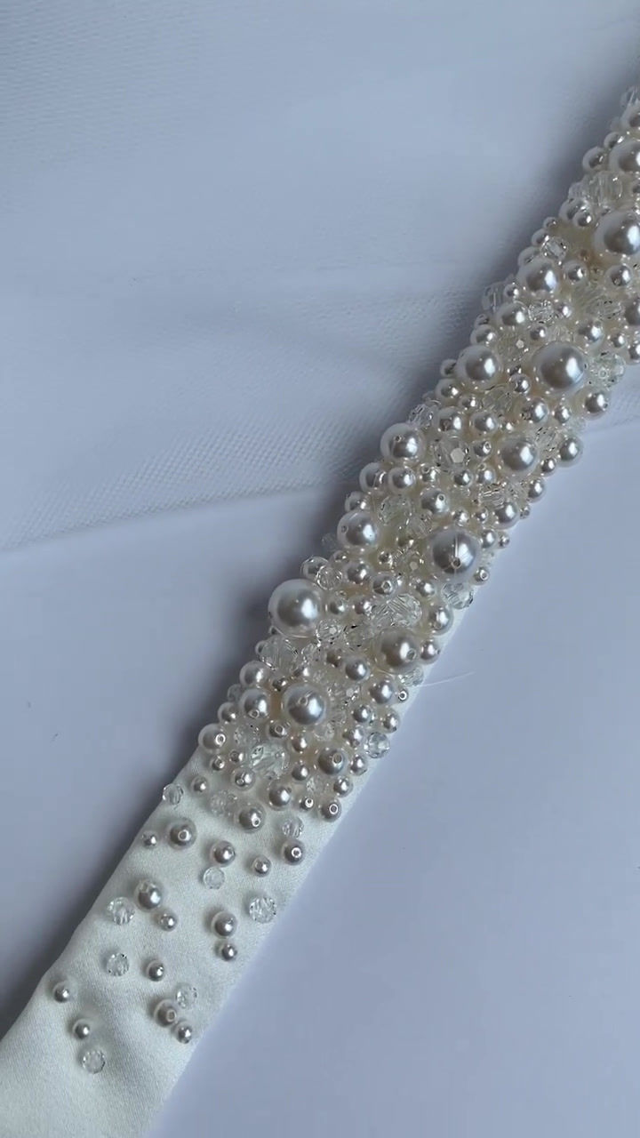 Thumbnail: Ivory satin bridal belt embellished with various sizes of ivory pearls and clear crystals