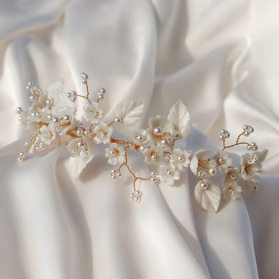 Thumbnail: Gold wire bridal headpiece embellished with ivory clay flowers and leaves, ivory pearls and clear crystals