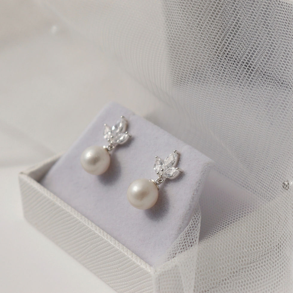 Thumbnail: Silver earrings with a stud of three marquise shape cubic zirconia and ivory pearl dropper