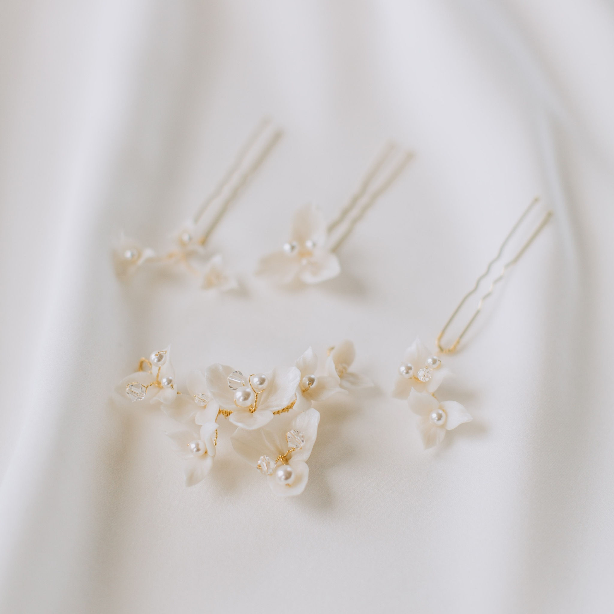 Small gold wire headpiece with ivory clay flowers and pearls and matching set of 3 hair pins