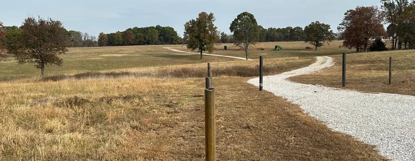 Gravel driveway along a field edge near Joplin and Neosho Missouri.
