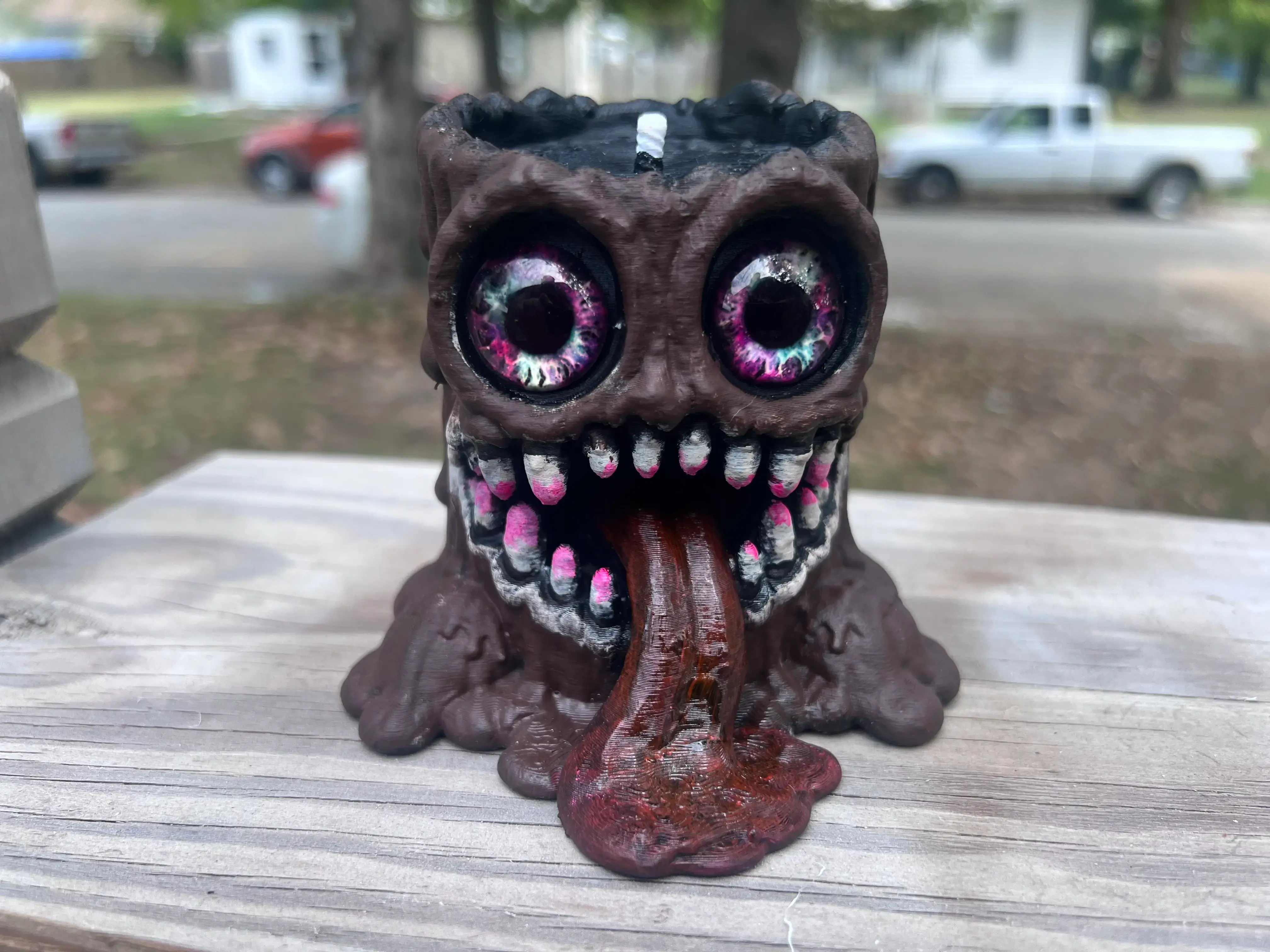 WaxMelt Ahorrible hand-painted 3D printed melted candle monster with large colorful eyes and dripping tongue