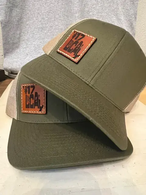 Thumbnail: Olive green 417 Local snapback trucker hat with tan mesh back, featuring a brown leather patch with "417 Local" and Route 66