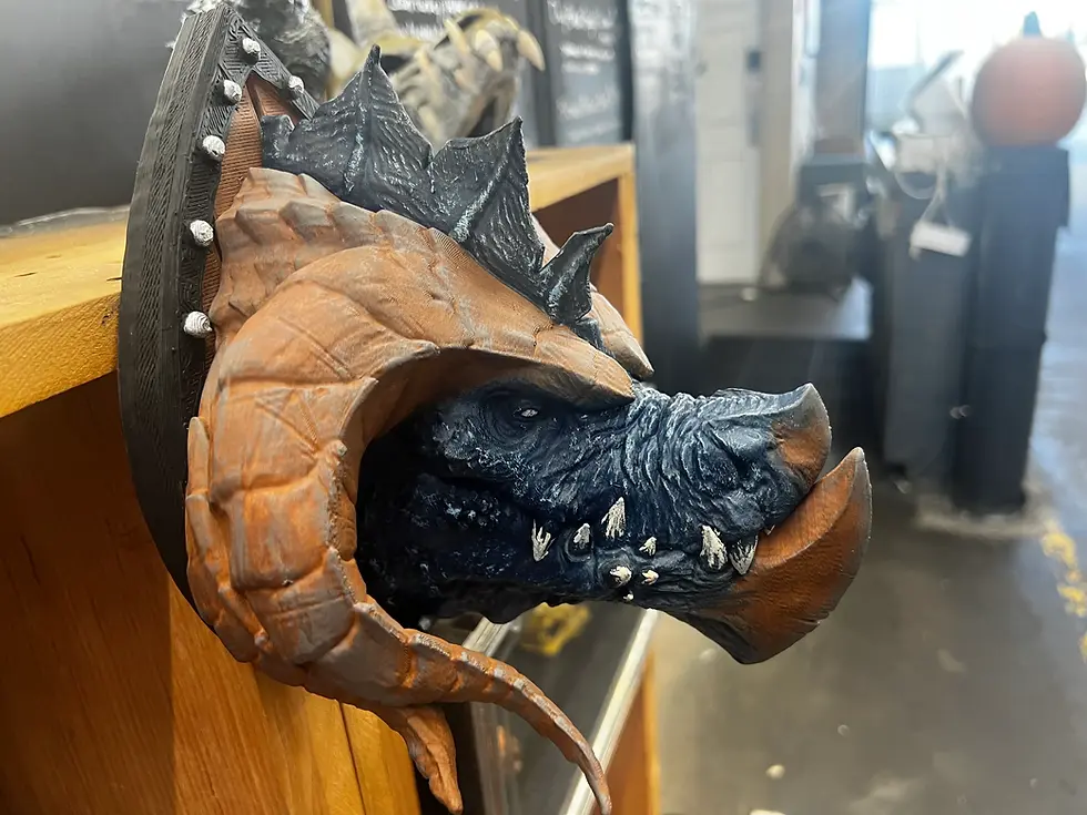 Thumbnail: Right-profile closeup of dragon head with weathered horns, blue-black scales, and ivory teeth.