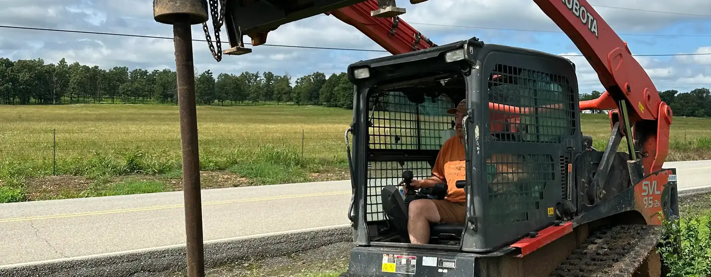 Skid steer post driving work near Joplin and Neosho Missouri.
