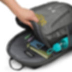 Interior shot: “Open backpack showing notebooks, phone, bottle, and inside organizer beneath ‘Jesus Saves’ flap.”