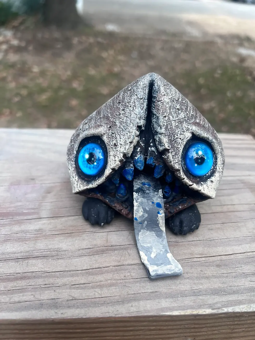 Misfortune Cookie Ahorrible 3D printed collectible with bright blue eyes and hanging fortune slip tongue