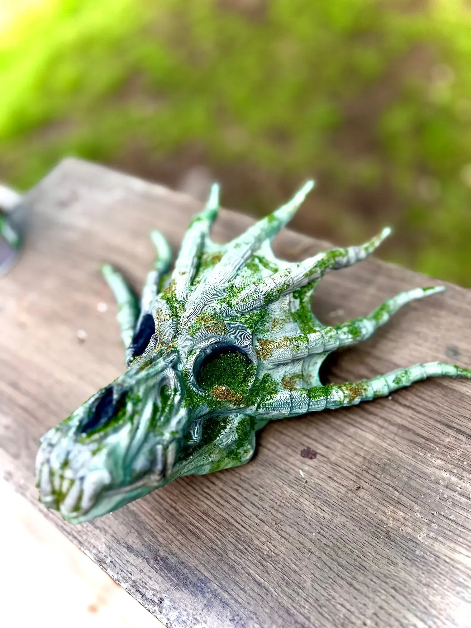 Image of a 3d printed water dragon skull hand painted and designed to look like an artifact.