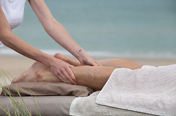 leg massage on the beach