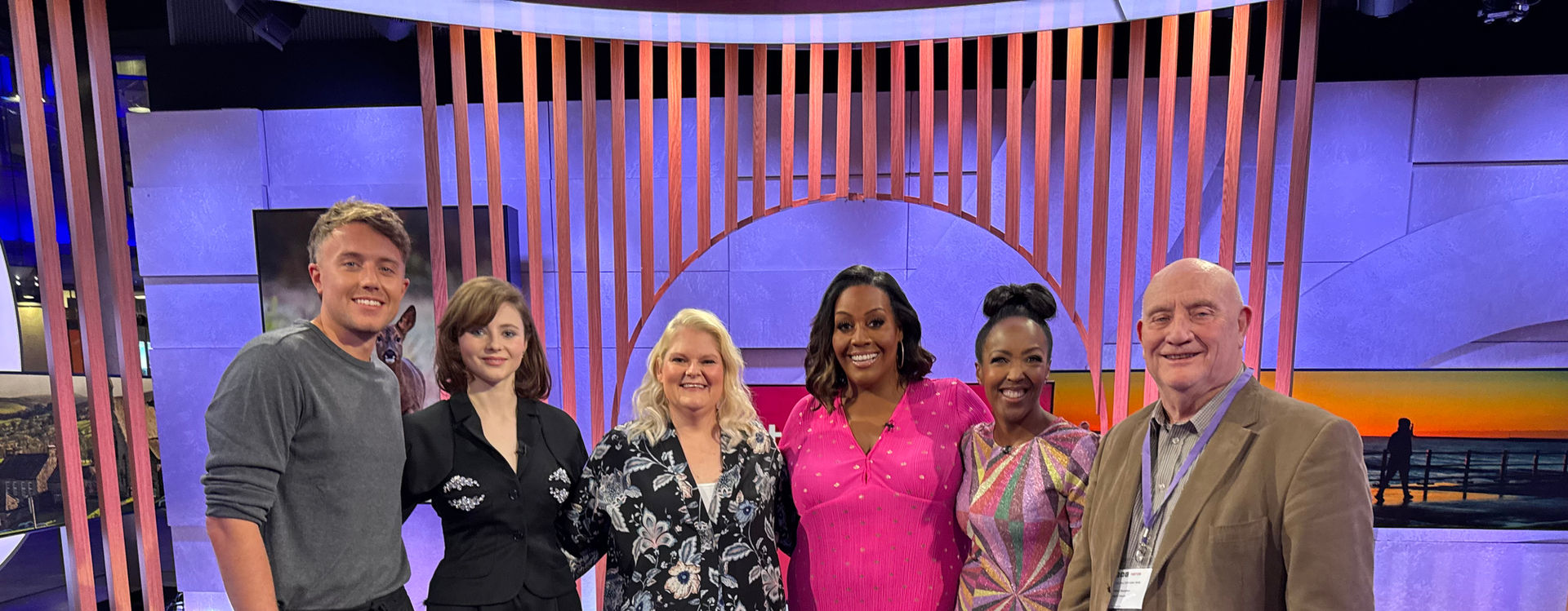 Louise Brown and Martin Powell pose on the BBC One Show Set, with hosts Roman Kemp, Angelica Bell and other guest Alison Hammond.