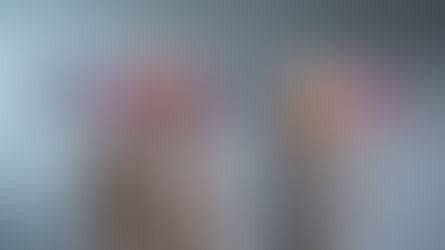 Martin Powell and Natalie Birrell stand in front of an Empica logo on a grey wall