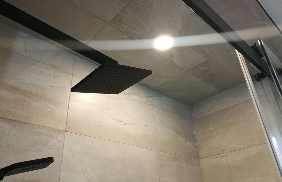 Tiled shower with ceiling light