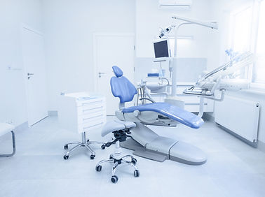 Modern dental practice. Dental chair and other accessories used by dentists in blue, medic