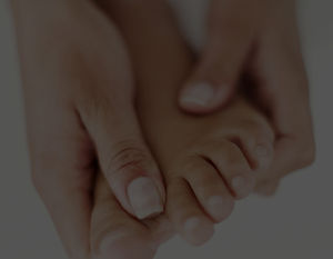 Hands holding foot_edited_edited.jpg