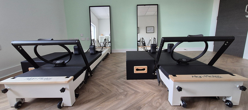 Two reformer pilates machines from frontal viex
