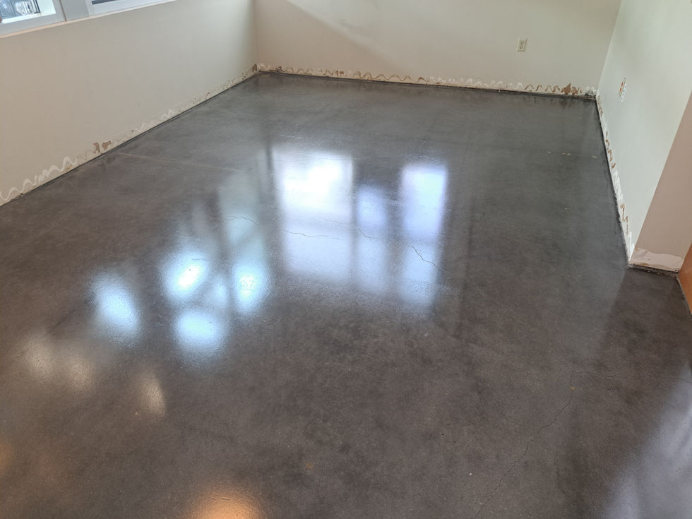 Before and after images showcasing the transformation of Land Rover's flooring from carpet squares to a sleek, modern finish.