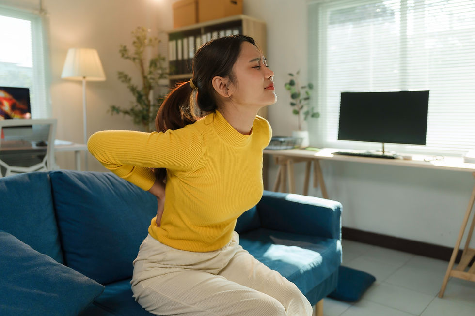 woman-experiencing-back-pain-while-sitting-on-couc-2026-03-24-07-35-19-utc.jpg