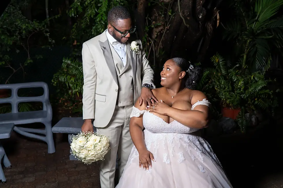 Portrait of bride and groom smiling at each other.