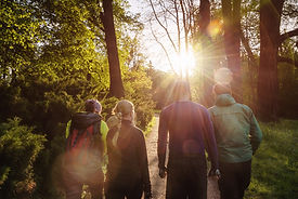 Group of friends walking with backpacks