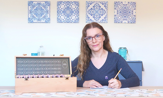2 elena maro bfrp bach flower remedies consultations in her consultation room with a notebook, pencil and the complete set of 38 bach flower remedies