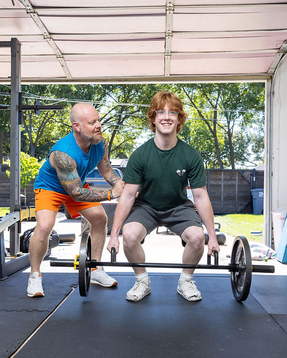 Randy trainiing Henry - his son looking to build muscle and mental resilience