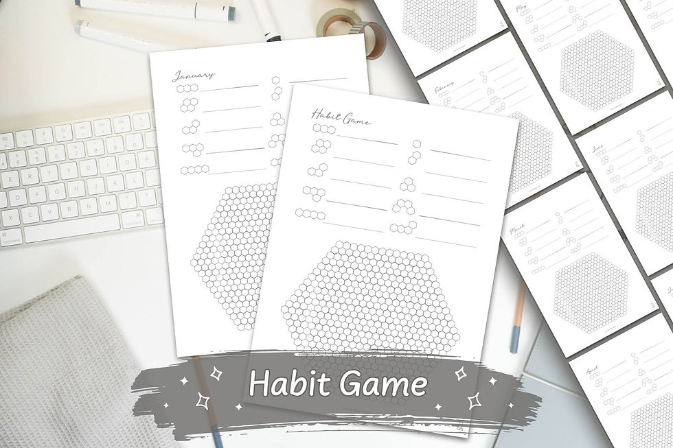 Grey Hand-Drawn Hexagon Habit Game Digital Download on a white desk with grey stationary