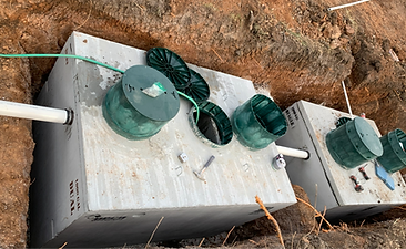Tanks have been connected, filling with water to prevent floating, risers have been added and almost ready for backfilling.