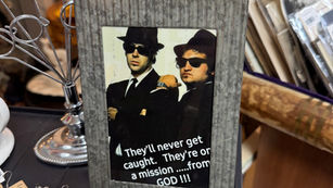 Framed film still promoting the 1980 movie The Blues Brothers.