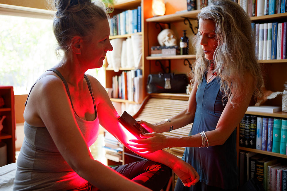 A professional LED light therapy machine using a near infrared light therapy device on the elbow