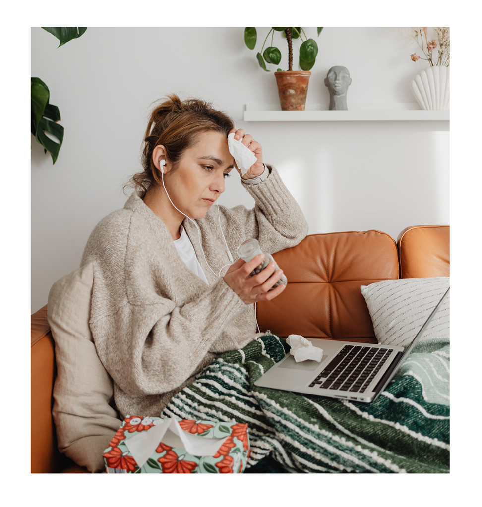 Woman with chronic illness reviewing medical information and trying to understand her MCAS health journey, symptoms, and medical records.