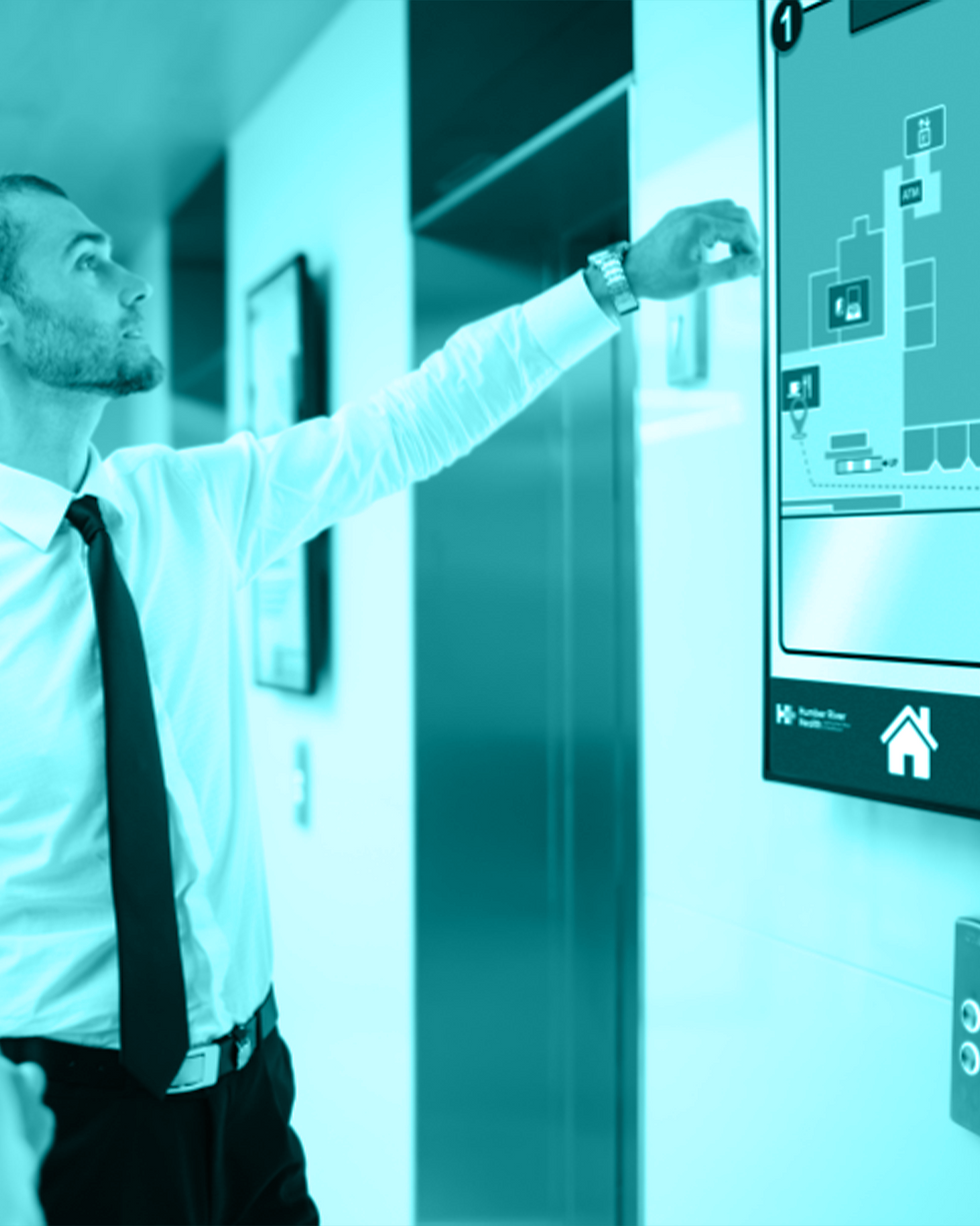 Businessman looking at interactive bulletin board with teal overlay