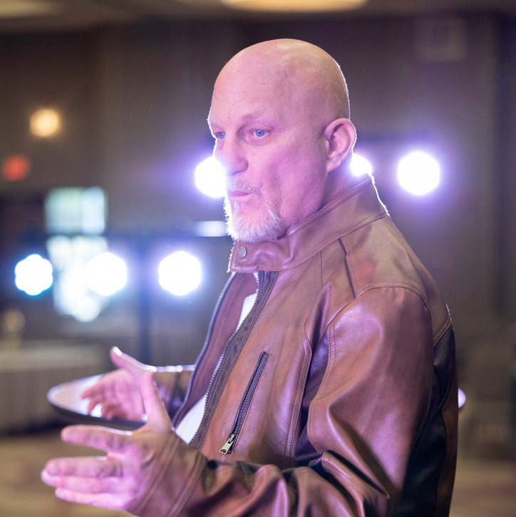 Leadership communication expert speaking at an event.