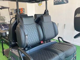 Diamond stitched high-back bolster seats with matching color stitching and 26" Sound Extreme sound bar.