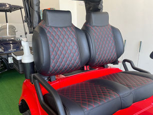 Diamond stitched high-back bolster seats with matching color stitching and 26" Sound Extreme sound bar.