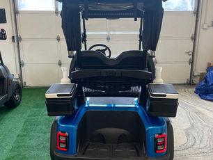 Golf package includes bag holder, sand and seed bottles, dual coolers, and golf club rain cover. LED taillight and license plate holder completes the package.
