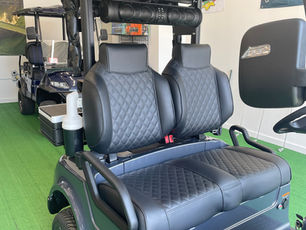 Diamond stitched high-back bolster seats with matching color stitching and 26" Sound Extreme sound bar.