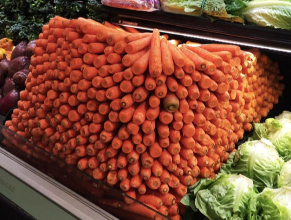 Stack of carrots in produce section of Good Earth store