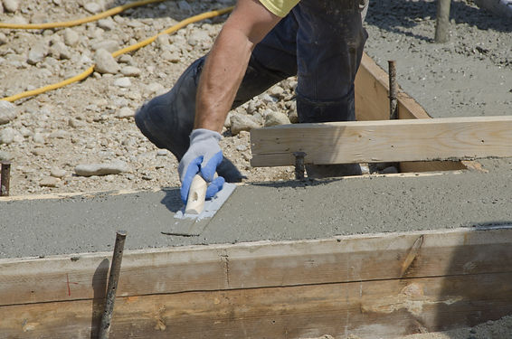 Pinnacle Site Solutions constructing a retaining wall.