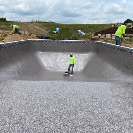 workers working on pool construction
