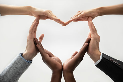 Close up bottom view concept of diverse business people join hands forming heart. Show uni