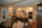 Luxury kitchen remodel featuring semi-custom cabinets, tile backsplash, copper farmhouse sink, and s